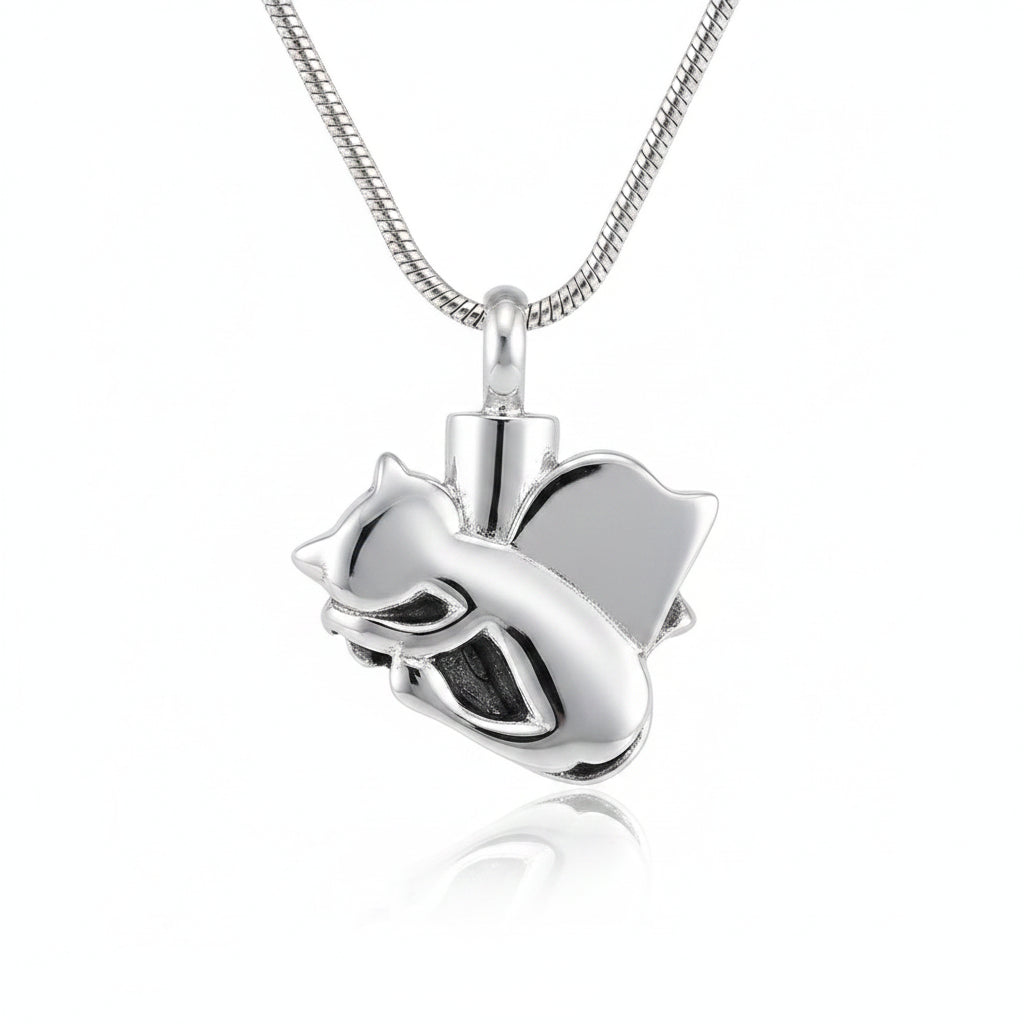 Silver angel pendant necklace on a dark textured surface